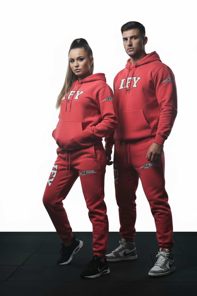 Red sweatpants with an elastic waistband and drawstring, featuring a white and black 'FAY' graphic on the right leg and a black and silver 'DF' logo on the left leg.