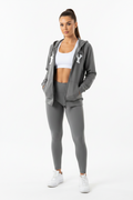 Beige hoodie with a brand label on a white background