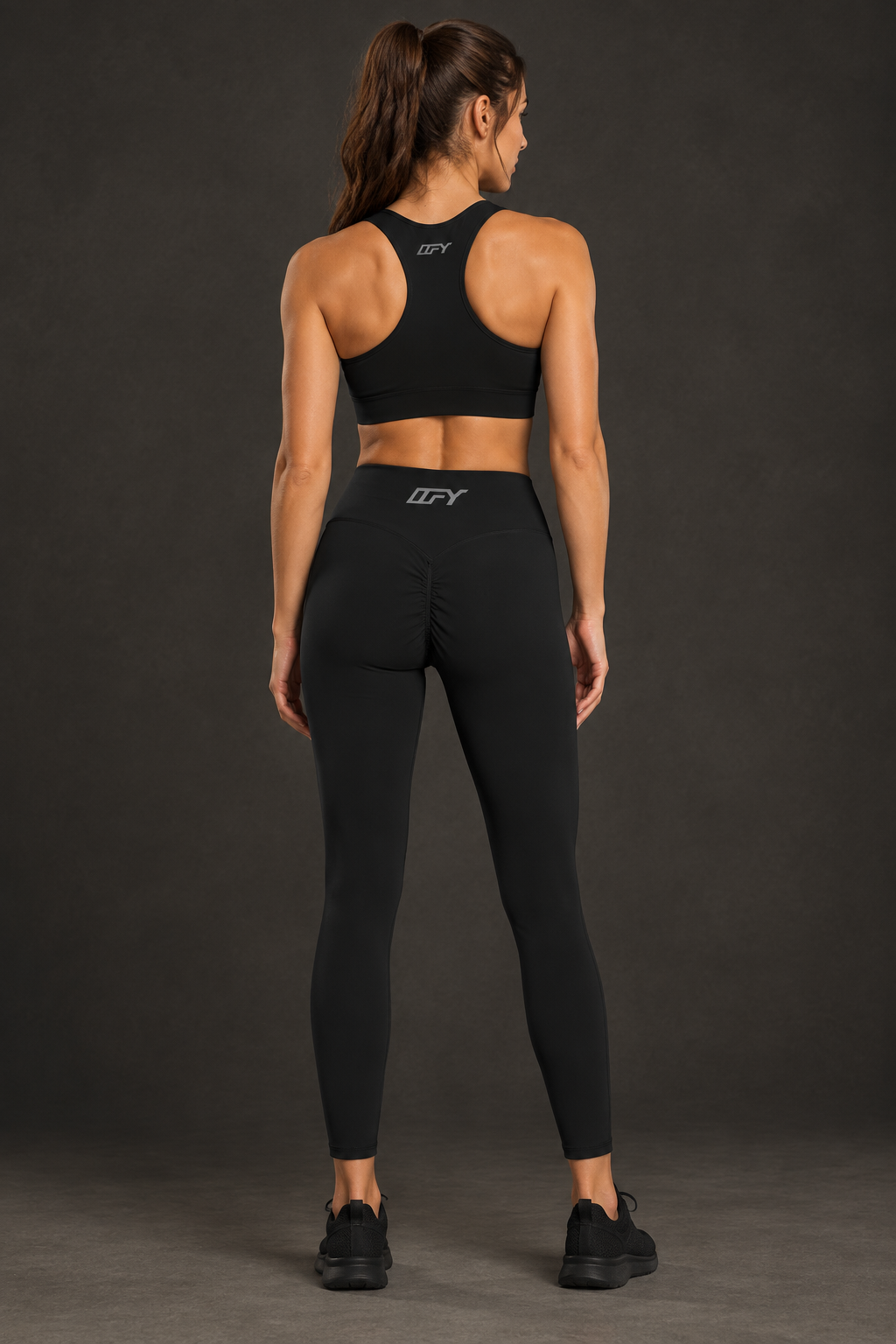 Ankle-length leggings back view with logo on sports bra 2