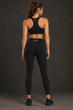 Ankle-length leggings back view with logo on sports bra 2