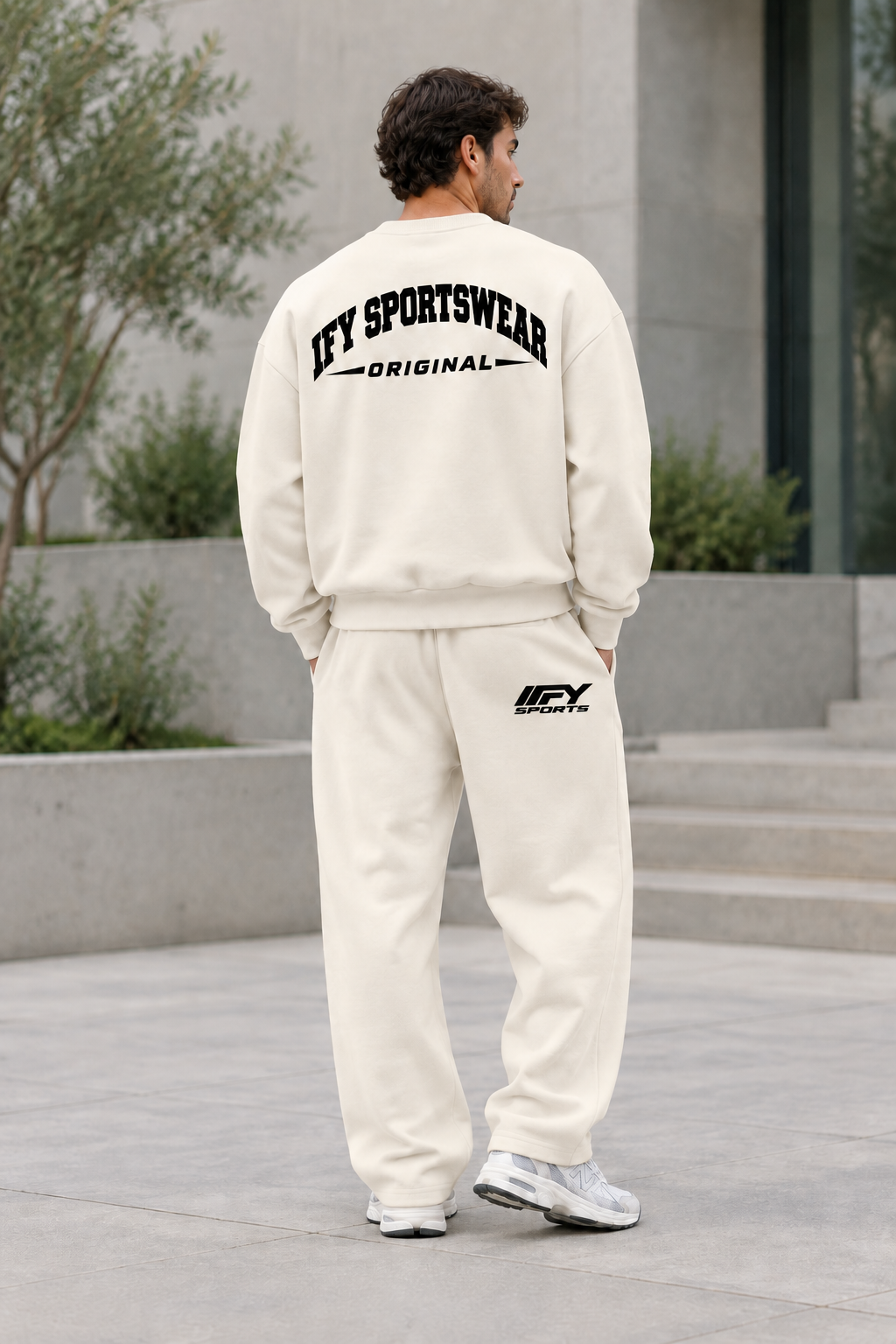 Corrected male back view with the black IFY SPORTS logo on the cream trousers