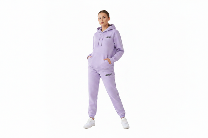 Light purple jogger sweatpants with an elastic waistband and cuffs, featuring a small black and green 'MFX' logo on the left thigh, shown against a plain white background.