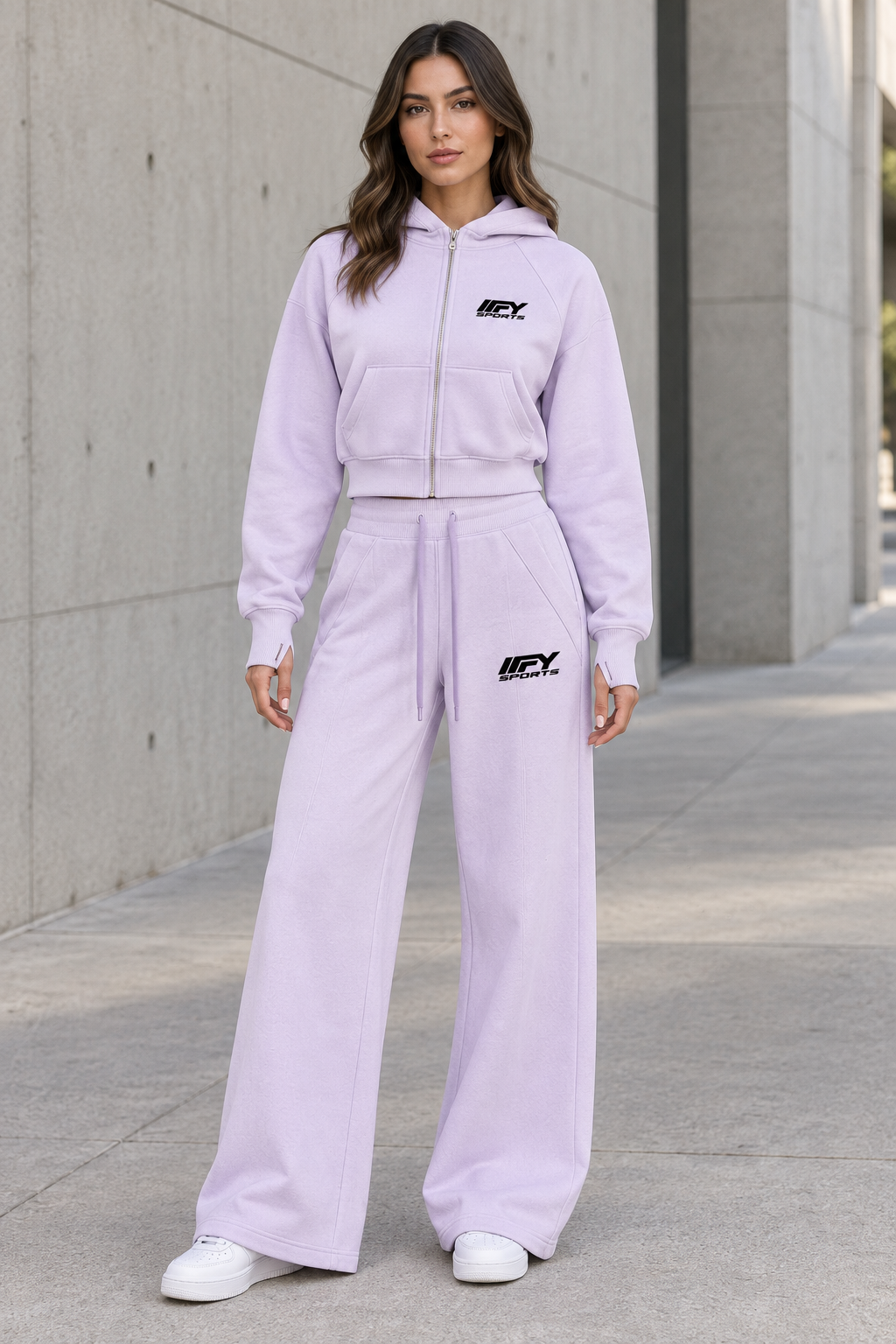 Female model front view wearing the lilac IFY cropped zip hoodie and wide-leg sweatpants