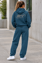 Female model showing the back of the blue IFY set with white Air Force 1 trainers