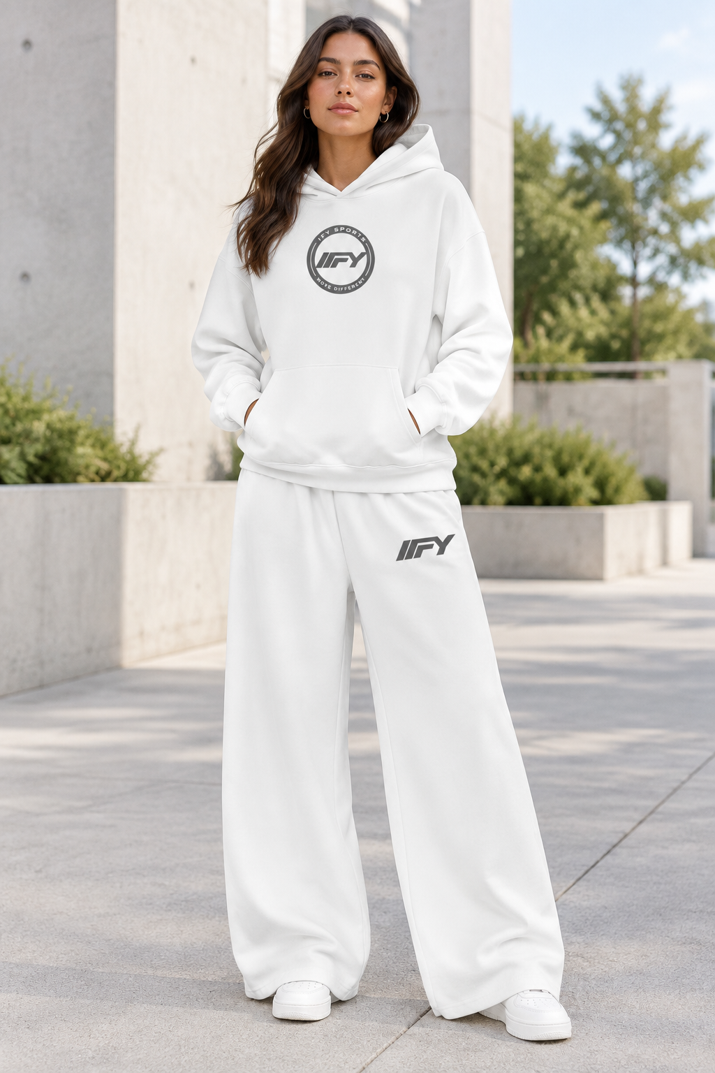 Female model wearing the white IFY outfit outdoors