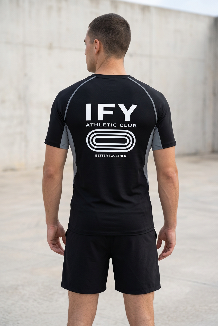 Back view of male model wearing IFY black and grey raglan panel training T-shirt