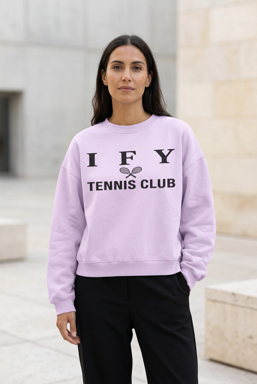 Front view of female model wearing light-purple IFY Tennis Club boxy fleece sweatshirt