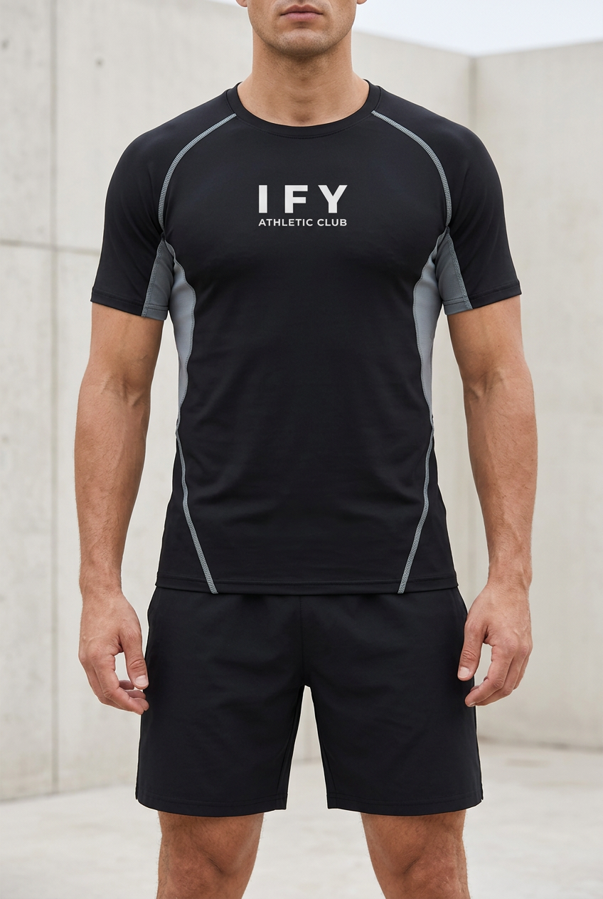 Front view of male model wearing IFY black and grey raglan panel training T-shirt