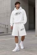 Male model front view wearing the white IFY hoodie and shorts with Nike trainers