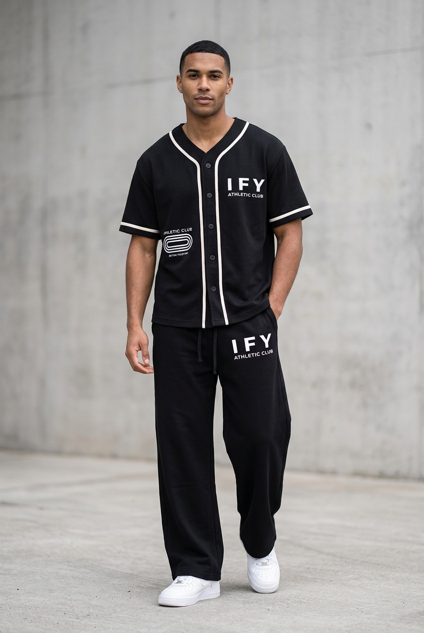 Male model wearing black IFY jersey and sweatpants, front view