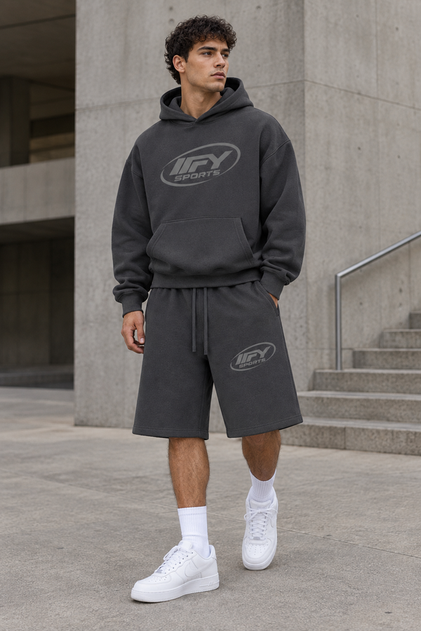 Male model wearing the charcoal IFY hoodie and shorts with Nike trainers in a streetwear pose