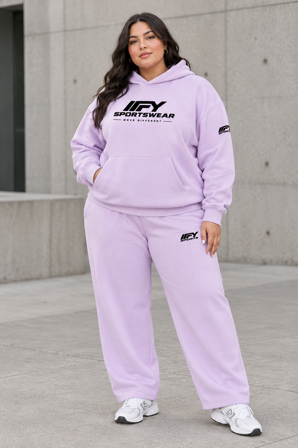 Plus-size female model wearing the lavender IFY hoodie and matching sweatpants