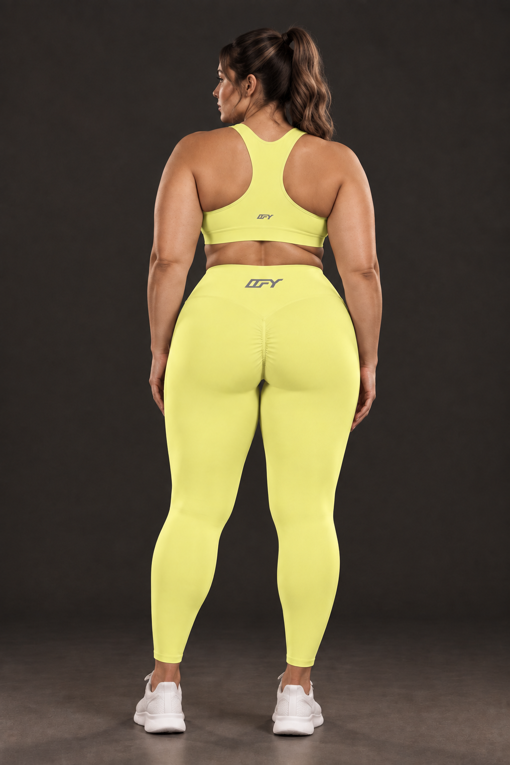 Plus-size model, back view with logo on sports bra (from back view 1)