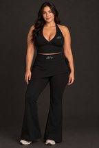 Plus-size model in the black halter top and skirted flare leggings