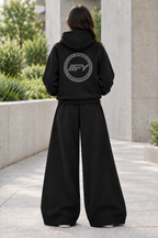 Rear view of the black IFY outfit with plain sweatpants