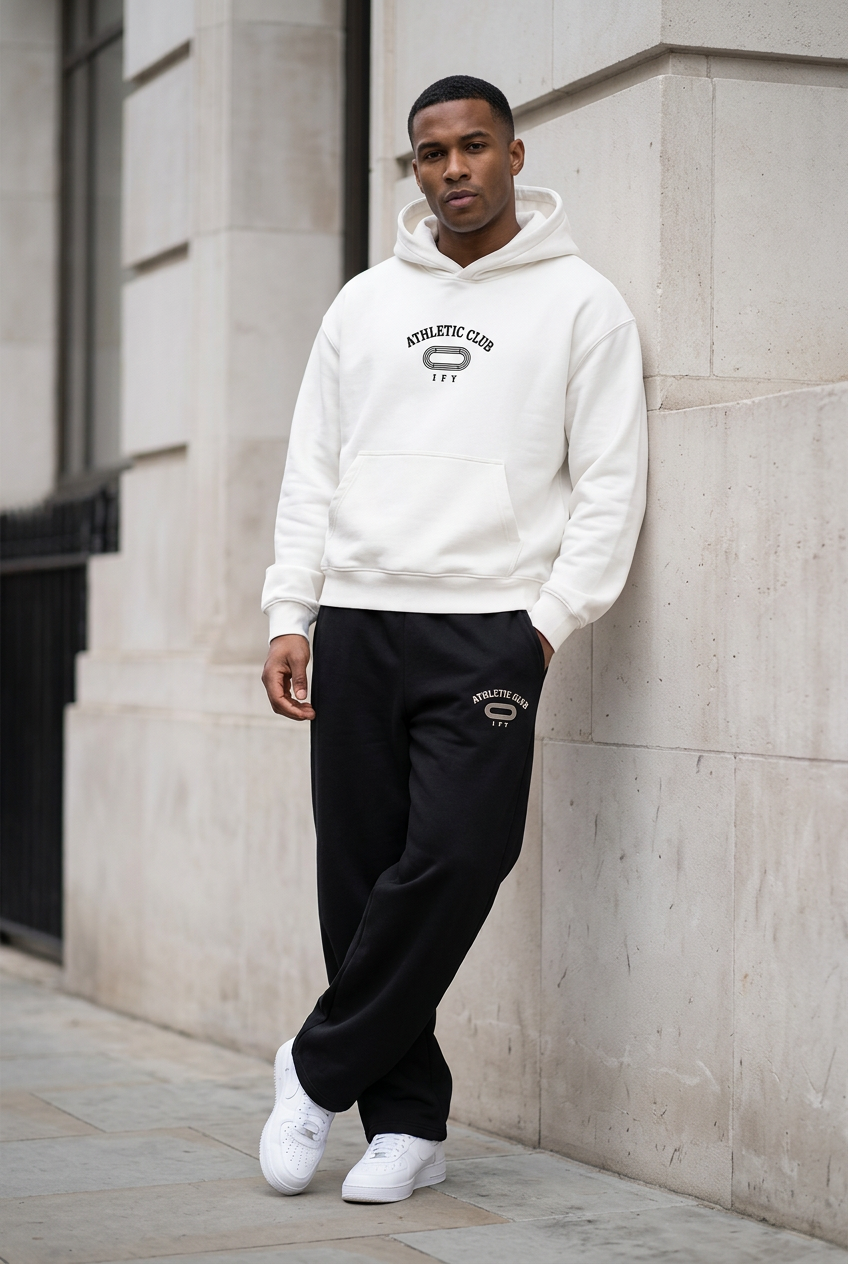 White Athletic Club hoodie and black trousers, front streetwear preview