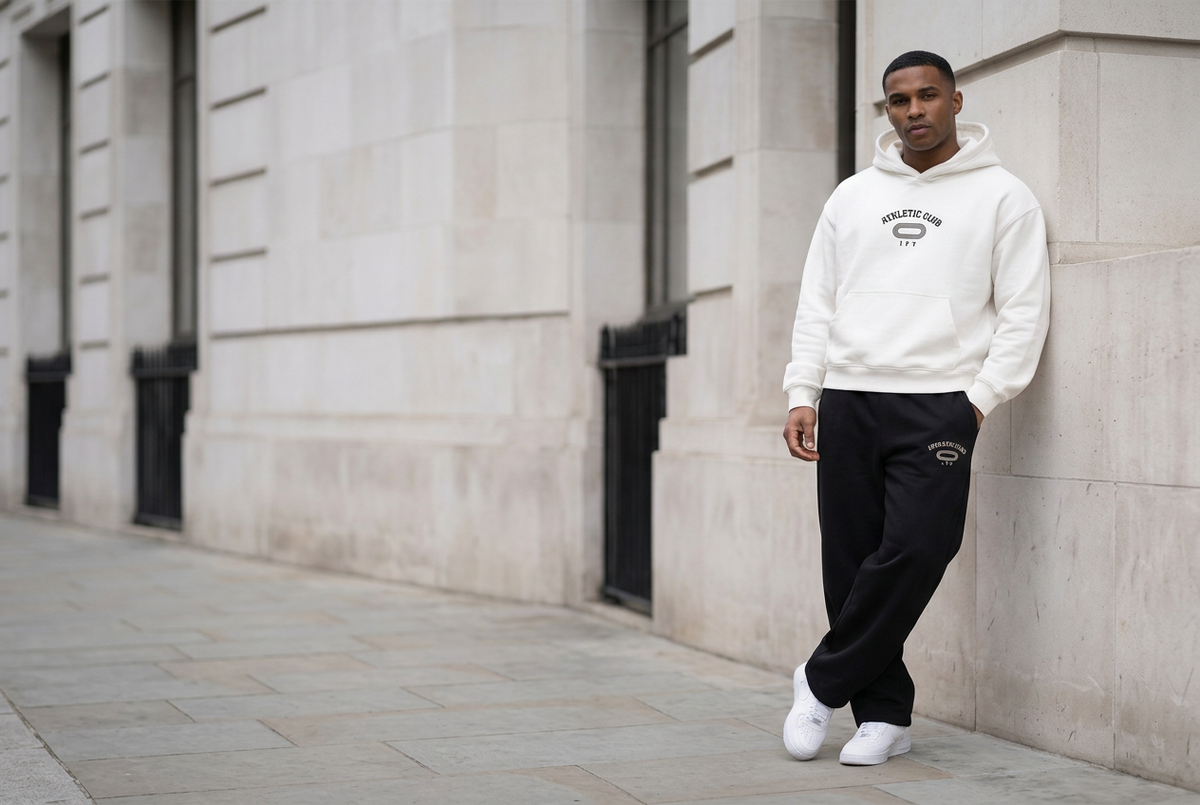 Wider white-hoodie and black-trouser desktop image